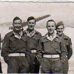 Harry Wood with other sergeants outside Trieste, Italy in 1946. The First World War monument can be seen in the background.