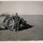 Sapper Grant getting matey with a wrecked jerry artillery piece field gun.