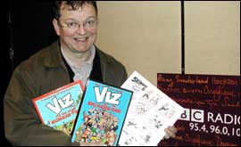 Chris Donald with some of the signed Viz goodies up for auction