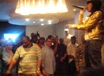 Lil' Mama performs on a pool table