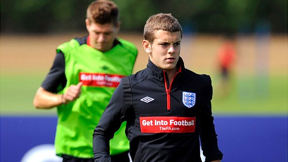 Jack Wilshere with Steven Gerrard in the background