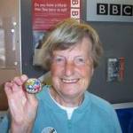 Anne Constain in 2005 holding a shell brooch decorarated by German internees on the Isle of Man in ww2