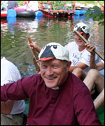 Bishop Peter Price on his raft in the moat