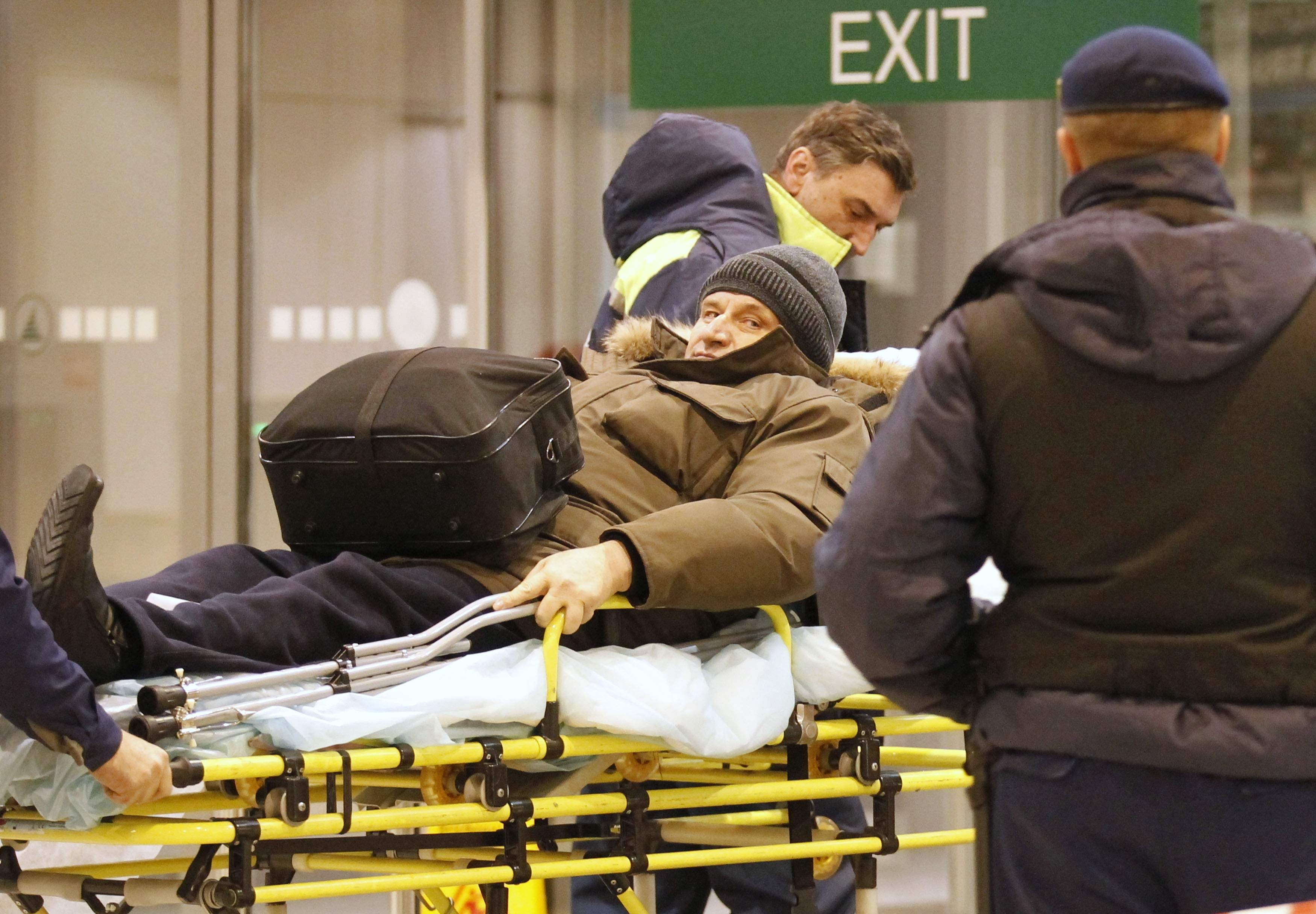 A victim of a bomb explosion is wheeled out by medics at Moscow