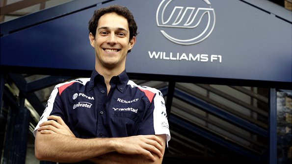 Bruno Senna posing with a Williams logo