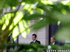 George Osborne and David Law hold a press conference in the garden of HM Treasury