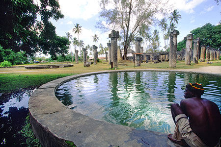 Man sitting by a pool, photo by Tom Ang