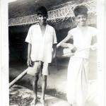 Two of the native bearers by the ‘Basha’. The instrument is a jam tin wedged between a split bamboo with a couple of wires stretched down.
