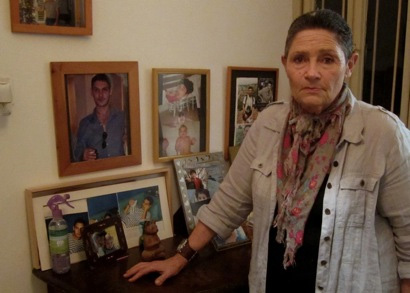 Robi Damelin and her family photo wall in her flat in Tel Aviv