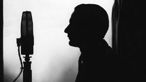 Silhouette figure with microphone