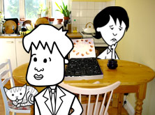 Tim and Helen in the kitchen with an empty box of chocolates