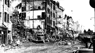 Black and white view of air raid destruction to Kilbowie Road in Clydebank.
