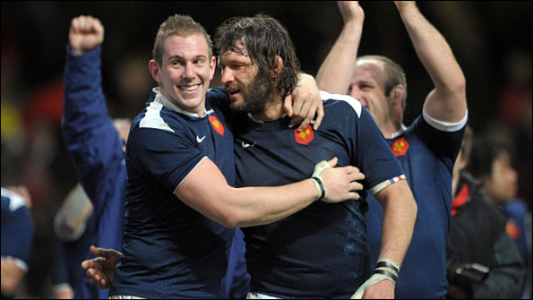 Flanker Imanol Harinordoquy and lock Lionel Nallet celebrate after France's victory in Cardiff
