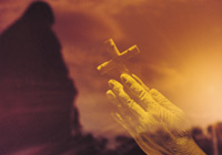 pic: hands holding a cross