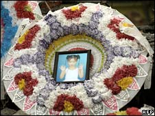 Picture of a little girl outside a collapsed school
