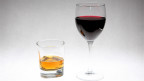 a glass of whisky and a glass of red wine