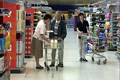 consumers shopping in a supermarket