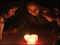 Children looking at candles