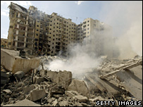 Smoke billowing from the rubble of a building in Beirut
