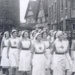 Jean Millington is 3rd from the front, without a red cross. She wrote 'I hadn't passed my exams at this point so had to unpick the cross from my apron'.