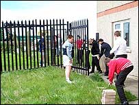 Students pile up the bricks.