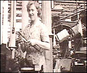 Woman weaver working in mill