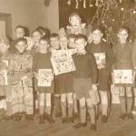 Christmas Party, Berkshire 1939. The presents were "on loan" for the picture which was taken for the East Ham Echo newspaper. Donald is fourth from the right and Henry second from left in the front row.