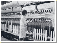 Photograph of a woman worker on spinning machine in Templeton’s factory 1964.