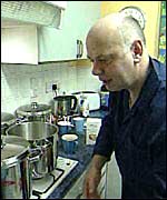 Dad prepares a meal for 14