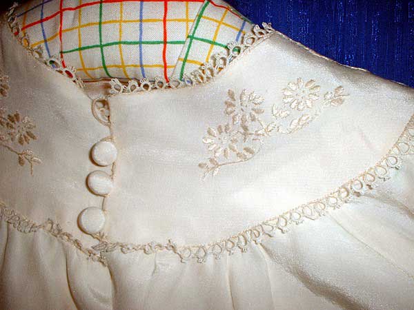 Close-up of neckline of carrickmacross lace christening dress by Thelma Goldring