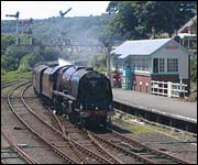 Steam train passes Falsgrave signal box
