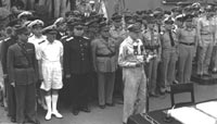General Douglas MacArthur opens the Japanese surrender ceremony on the USS Missouri on 2 September 1945. Leading Allied Officers are behind him