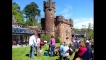 The audience pack up their picnics after a sunny day of music.