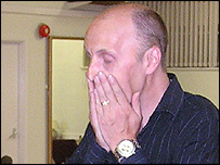 James Hazell holds his face