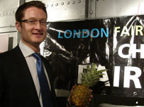 Cllr Joshua Peck with a fairtrade pineapple