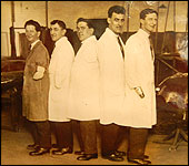 Each man has lost an arm and a leg and is still smiling