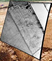 a photograph of marks in a field showing a funnel arrangement