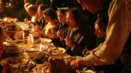 Men and women eating Christmas dinner