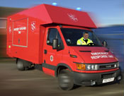 Bright red emergency vehicle, with the Salvation Army logo displayed on its sides